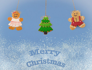 Christmas cookies of different shapes and sizes with a festive decor on a blue background. Holiday Poster concept.  Empty place for a postural inscription