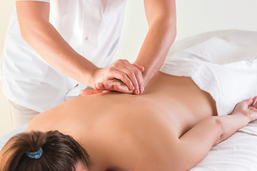 Obraz na płótnie Canvas The picture of beautiful woman in massage salon