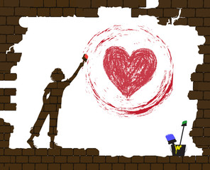 boy draws a red heart by paint on the old broken brick wall, life after war, new life after disaster idea, protect homeless children idea graffiti,