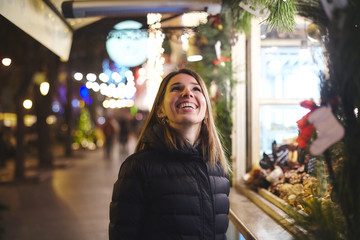 Woman at Christmas market looking up smiling, Odessa, Odessa Oblast, Ukraine, Europe