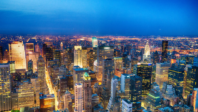 Aerial view of Midtown skyscrapers at night, New York City - Powered by Adobe