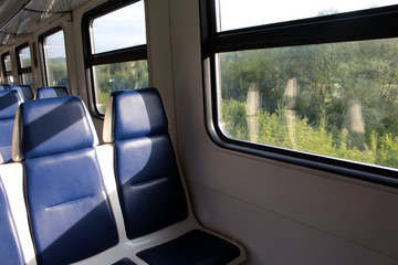 Inside the cabin of modern Express trains. blue chair by the window.