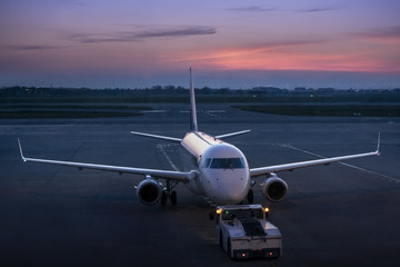 Towing of civil airplane of business aviation in twilights. 