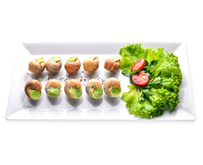 French and Italian cuisine. Baked snails. Isolated on a white background.