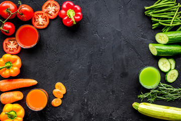 Fresh detox beverages with vegetables on black background top view copyspace
