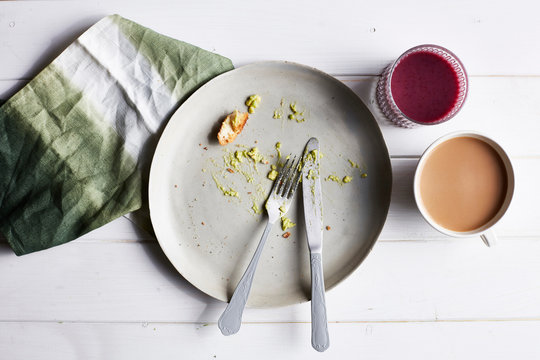 Eaten avocado meal, overhead view