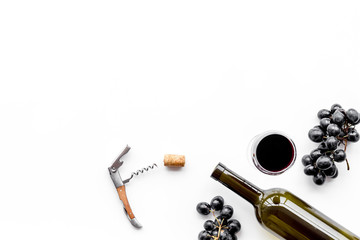 Open the wine. Corkscrew near bottle, glass, grape on white background top view copyspace