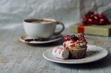 Mm..Delicate vanilla capcakes with whipped cream, juicy strawberries, milk chocolate and a cup of strong and fragrant coffee will help start this day with positive thoughts.