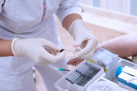 Cropped view of medical professional performing blood test
