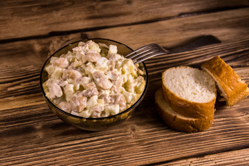Salad with white kidney beans, potatoes, chicken meat, eggs and mayonnaise