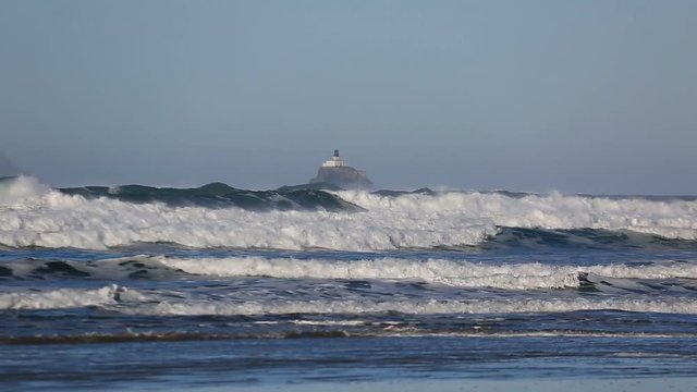 High definition 1080p video of crashing waves with decommissioned Tillamook Lighthouse along Oregon coast in Pacific Ocean Winter season 1920x1080
