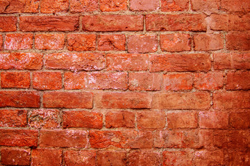 Old red brick wall. Texture construction masonry hand-made bricks. Ancient building architecture.  