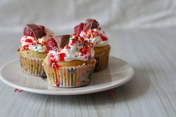 Delicate vanilla capcakes with whipped cream, juicy strawberries, milk chocolate and a cup of strong and fragrant coffee will help start this day with positive thoughts.