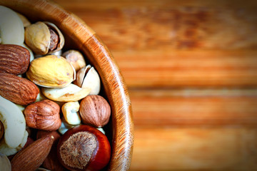 Assorted nuts in wooden bowl