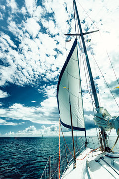 Fototapeta Yachting on sail boat during sunny weather