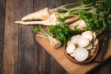 Fresh parsley root on the wooden table - obrazy, fototapety, plakaty