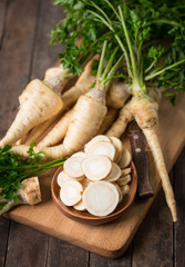 Fresh parsley root on the wooden table - obrazy, fototapety, plakaty