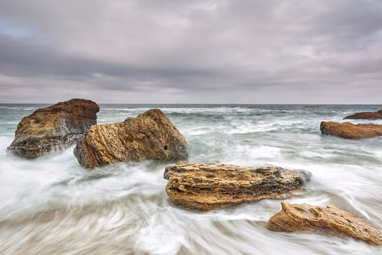 Long exposure of waves on rocks in sea, Odessa, Odeska Oblast, Ukraine, Europe