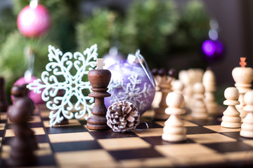 Christmas tree and chess board with figures.