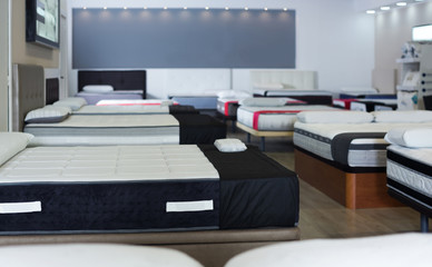 new mattresses on the beds in the store