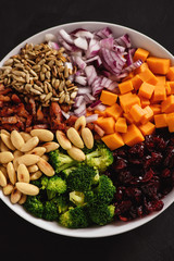 Broccoli salad with yogurt dressing, cheese, bacon, almond and cranberries.