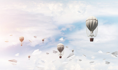 Flying hot air balloons in the air.