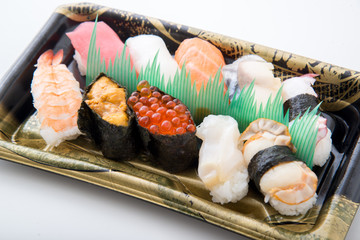 packed sushi in plastic tray