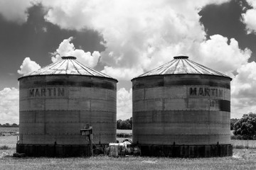 Grain Silos in Field with Clouds - 183807676