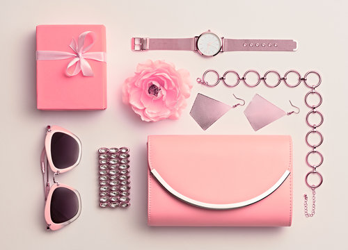 Fashion. Woman Pink Accessories Set. Flat lay. Trendy Rose Gold Watch, Summer Sunglasses, Glamour fashion Clutch. Flower. Luxury Stylish Spring lady. Pastel Color