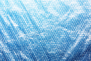 Blue plastic bag aqua background