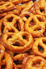 Pretzel shaped bread sticks cracker texture pattern. Salted pretzels. Food photo.