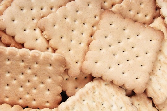 Biscuit sweet cookie craker background. Domestic stacked butter biscuit pattern concept. Biscuits texture close up macro. Food photo studio photography. Biscuits.