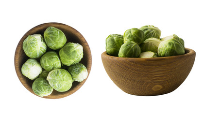 Brussels sprouts cabbage in wooden bowl. Brussels sprouts cabbage isolated on a white background. Cabbage with copy space for text.