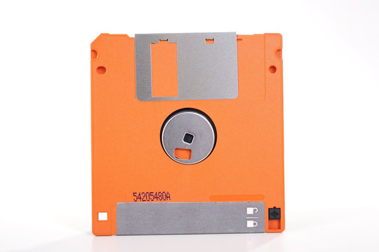 Flopys or floppys vintage technology. Floppy or flopy disc retro computer data storage. Orange.
