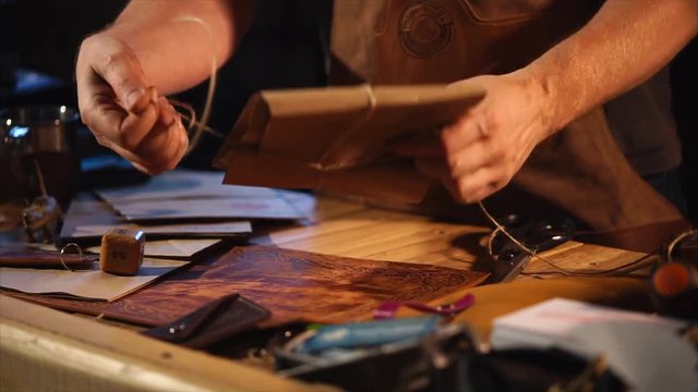 Vintage style package for handmade products. Handiwork is packed into tied paper bag with stamps