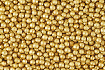 Close up of little golden balls