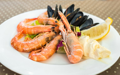 Tasty seafood on plate on table close-up, Siurana, Catalunya, Spain.