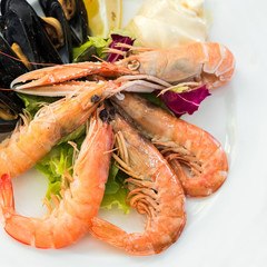Tasty seafood on plate on table close-up, Siurana, Catalunya, Spain.
