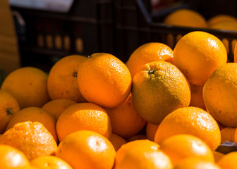 Fresh oranges are sale in the local market, Siurana, Catalunya, Spain. Close-up.