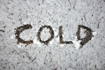 Word cold handwritten in snow 
