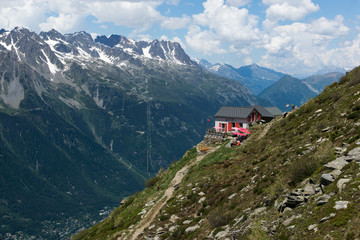 Alone building on the mountain peaks in European Alps. France - 13 June, 2014