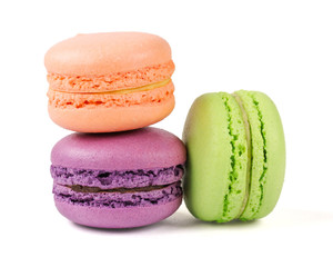 Three multicolored macaroons on a white background. Isolated.