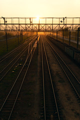 Fototapeta na wymiar Beautiful sunset on the background of railway tracks