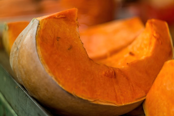 Big pumpkin slice on the market stand