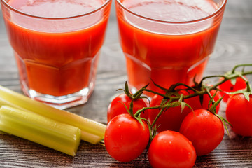 Glass of tomato juice with fresh tomatoes