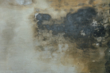 Grungy wall texture. Old shabby cement plaster with water trails and mold inclusions