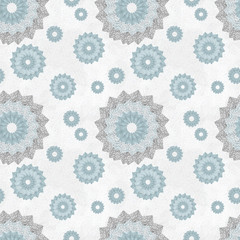 Seamless pattern with ornament of openwork lace round shapes. Geometric background with snowflake effect, pale blue and light gray. Delicate, airy, nice, soft, elegant, artistic image