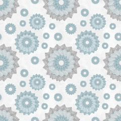 Seamless pattern with ornament of openwork lace round shapes. Geometric background with snowflake effect, pale blue and light gray. Delicate, airy, nice, soft, elegant, artistic image