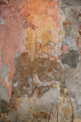 Grungy wall texture. Old shabby cracked cement plaster with water trails