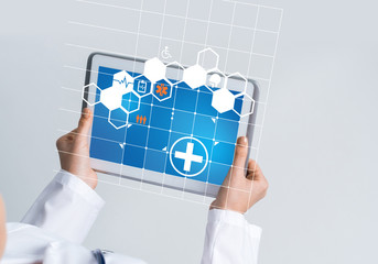 Close of female doctor hands working with tablet pc computer